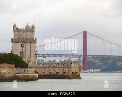 Belem Tower or Torre de Belém and the 25 de Abril suspension bridge over the Tagus river in Lisbon, Portugal, Europe Stock Photo