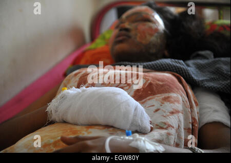 Dhaka, Bangladesh. 2nd March, 2015. Kuntola Sikdar 24 an university student who suffered burn injuries after a petrol bomb attack on a bus last night is treated at the Dhaka Medical College Hospital in Dhaka. Political attacks, mostly firebombings of vehicles, have killed more than 100 people since early January, when an opposition alliance led by Khaleda Zia ordered a transportation blockade in an attempt to force Prime Minister Sheikh Hasina to step down. Credit:  zakir hossain chowdhury zakir/Alamy Live News Stock Photo