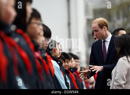 Shanghai, China. 3rd Mar, 2015. Britain's Prince William interacts with students during a visit to a Premier League training camp at Nanyang Secondary School in Shanghai, east China, March 3, 2015. Credit:  Jin Liangkuai/Xinhua/Alamy Live News Stock Photo