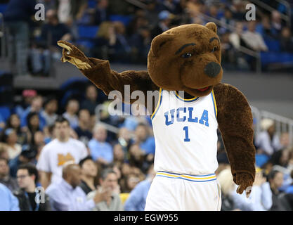 March 1, 2015: Washington State Cougars and UCLA Bruins, Pauley Pavilion in Los Angeles, CA. Joe Bruin offers the ref a little help. Stock Photo