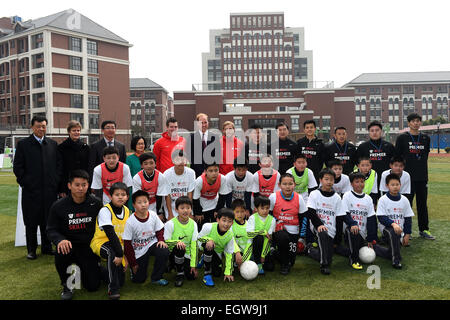 Shanghai, China. 3rd Mar, 2015. Britain's Prince William poses for a group photo with students during a visit to a Premier League training camp at Nanyang Secondary School in Shanghai, east China, March 3, 2015. Credit:  Jin Liangkuai/Xinhua/Alamy Live News Stock Photo