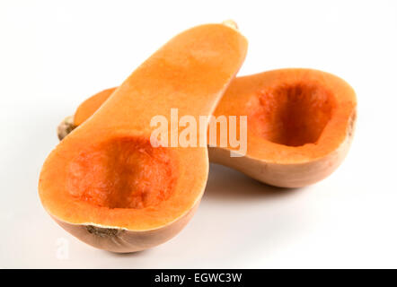 Butternut squash cut in half and deseeded on white background Stock Photo