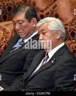 Tokyo, Japan. 3rd Mar, 2015. Japan's Defense Minister Gen Nakatani, foreground, and State Minister Shigeru Ishiba listen to opposition lawmaker during a budget commettee deliberation at the Diet's lower house in Tokyo on Tuesday, March 3, 2015. Credit:  Natsuki Sakai/AFLO/Alamy Live News Stock Photo