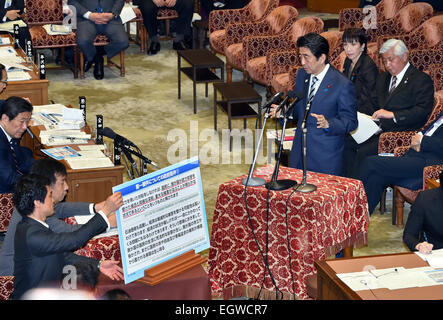 Tokyo, Japan. 3rd Mar, 2015. Japan's Prime Minister Shinzo Abe, standing at right, answers an opposition lawmaker during a budget committee deliberation at the Diet's lower house in Tokyo on Tuesday, march 3, 2015. The deliberation was focused upon illegal handling of political funds by two key Cabinet ministers. Credit:  Natsuki Sakai/AFLO/Alamy Live News Stock Photo