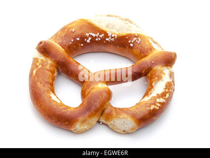Freshly baked salted lye pretzel. All on white background. Stock Photo