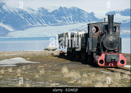 The old steam train used for mining in the past which now sits near the shore in Ny-Ålesund, Spitsbergen, Svalbard Stock Photo