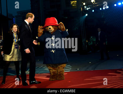 Shanghai, China. 3rd Mar, 2015. Britain's Prince William walks with a person wearing a Paddington bear costume during the Chinese premiere of 'Paddington' at Shanghai Film Museum in Shanghai, east China, March 3, 2015. Credit:  Jin Liangkuai/Xinhua/Alamy Live News Stock Photo