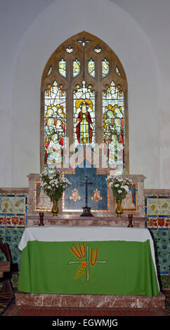 Altar & Stained Glass Window The parish church of St John the Evangelist, Cutcombe, Exmoor Stock Photo