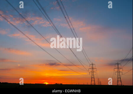 Power lines at sunset near kingsnorth power station Kent. Stock Photo