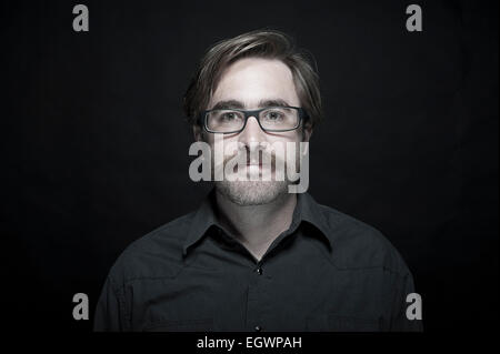 mid length and full length characterful shots of 20 something real people who work in media posing in various poses, laughing, Stock Photo