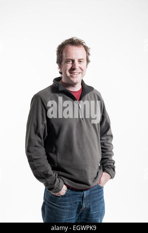 mid length and full length characterful shots of 20 something real people who work in media posing in various poses, laughing, Stock Photo