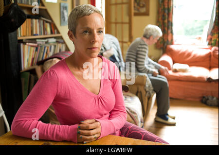 A daughter looking after her mother who is suffering from Alzeimer's. Stock Photo