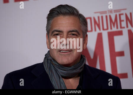 UNITED KINGDOM, London : American actor George Clooney poses for a photo call in front of 'Cupid complaining to Venus' by Lucas Cranach which was a painting that belonged in Hitlers private collection, in conjunction with the film 'The Monument men' in central London on February 11, 2014 Stock Photo