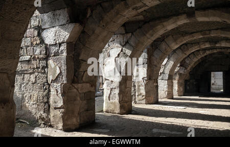 Dark corridor interior with arcs. Ruins of Ancient city Smyrna. Izmir, Turkey Stock Photo