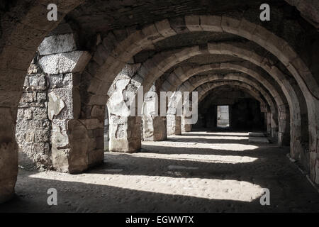 Interior of empty dark corridor with arcs. Ruins of Ancient city Smyrna. Izmir, Turkey Stock Photo