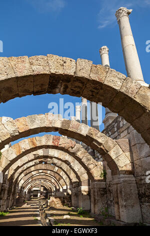 Empty corridor with arcs and columns above blue sky backgroud. Ruins of Ancient city Smyrna. Izmir, Turkey Stock Photo