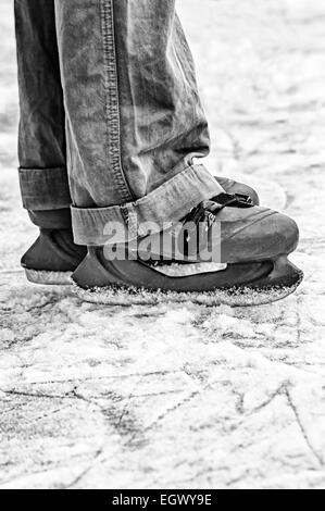 Wide skates on ice. Black and white image Stock Photo