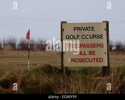 Trespassers will be prosecuted sign on the edge of a private golf course, Trevose Golf Club, Cornwall, UK Stock Photo