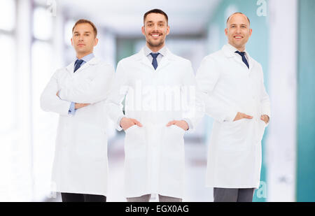 smiling male doctors in white coats Stock Photo