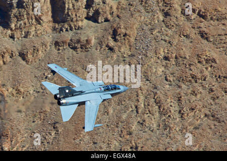 Royal Air Force Tornado GR4 Flying At Low Level Through A Desert Valley.