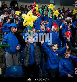 London Welsh rugby supporters celebrating on Saint David's Day (March 1st 2015) and waving inflatable daffodils Stock Photo