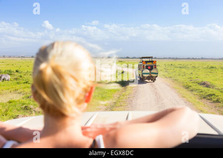 Woman on african wildlife safari. Stock Photo