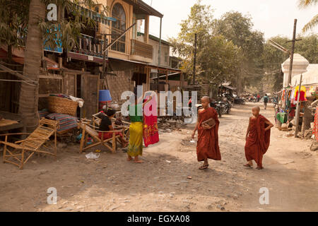 Local burmese people and buddhists monks walking on the road to Mandalay, Mandalay, Myanmar ( Burma ), Asia Stock Photo
