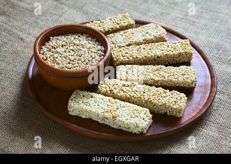 Popped quinoa seeds in bowl with quinoa cereal bars, one with honey the other mixed with amaranth Stock Photo