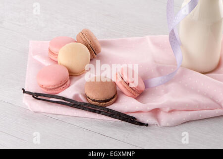 Classic Macarons with Raspberry, Coffee, Chocolate and Pistachios Filled with Cream, French Pastry Stock Photo