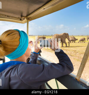 Woman on african wildlife safari. Stock Photo