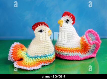 Chicken, egg cozies, crocheted Stock Photo