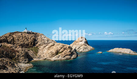 Ile de la Pietra with lighthouse at the tip of L'Île-Rousse, Haute-Corse, Corsica, France Stock Photo