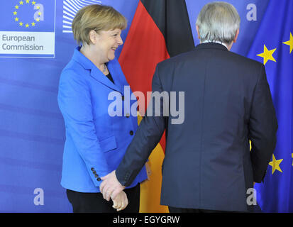 (150304) -- BRUSSELS,  March 4, 2015 (Xinhua) -- European Commission President Jean-Claude Juncker (R) welcomes German Federal Chancellor Angela Merkel prior to their meeting at EU headquarters in Brussels, Capital of Belgium, March 4, 2015. (Xinhua/Ye Pingfan) Stock Photo