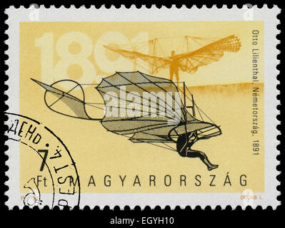 HUNGARY - CIRCA 1991: Stamp printed in Hungary from the 'The 100th Anniversary of Airplanes' issue shows Otto lilienthal and his Stock Photo