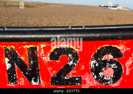 A number on a boat on the beach at Cley, Norfolk, UK. Stock Photo