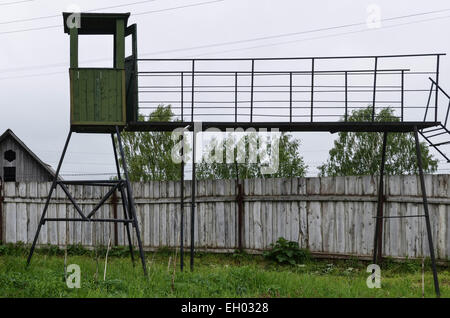 The former soviet gulag camp of Perm36, west of the Ural range in Russia near the town of Perm. Fence and watch tower. Stock Photo