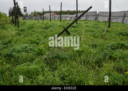 The former soviet gulag camp of Perm36, west of the Ural range in Russia near the town of Perm. Fence and watch tower. Stock Photo