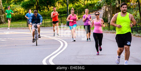 Bicycling and running in Central Park, Manhattan, New York City, USA Stock Photo
