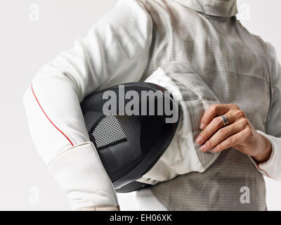 fencer with fencing mask under arm Stock Photo