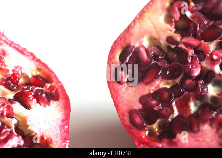 Still life close up food image of the halves of a Pomegranate Stock Photo
