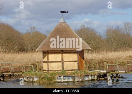 Fishermans hut and eel traps on River Test near Longstock Hampshire England. Stock Photo