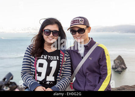 2, two, Asian women, posing for photograph, tourists, visitors, visiting, north side of Golden Gate Bridge, Vista Point, city of Sausalito, California Stock Photo