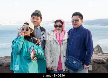 Asian family, family photo, posing for photograph, tourists, visitors, north side of Golden Gate Bridge, Vista Point, city of Sausalito, California Stock Photo