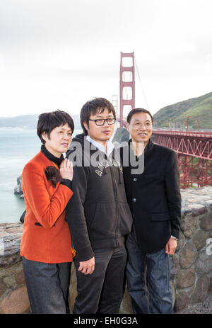 Asian family, posing for photograph, tourists, visitors, visiting, north side of Golden Gate Bridge, Vista Point, city of Sausalito, California Stock Photo