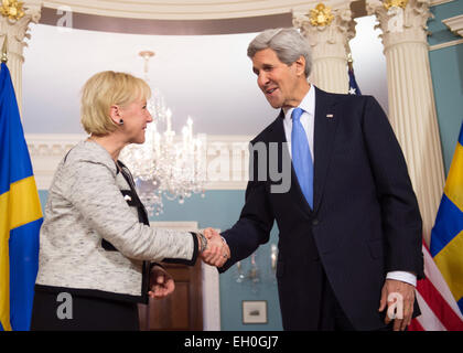 U.S. Secretary of State John Kerry shakes hands with Swedish Foreign Minister Margot Wallstrom after they addressed reporters at the U.S. Department of State in Washington, D.C., on January 29, 2015. Stock Photo