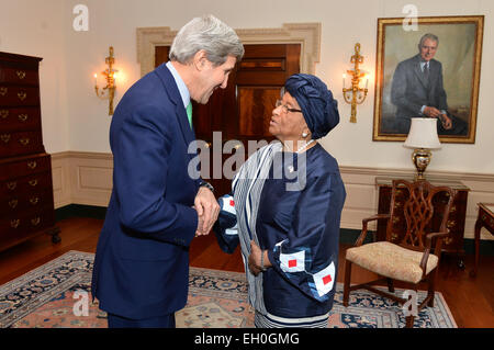 U.S. Secretary of State John Kerry greets Liberian President Ellen Johnson Sirleaf before their meeting at the U.S. Department of State in Washington, D.C., on February 27, 2015. Stock Photo