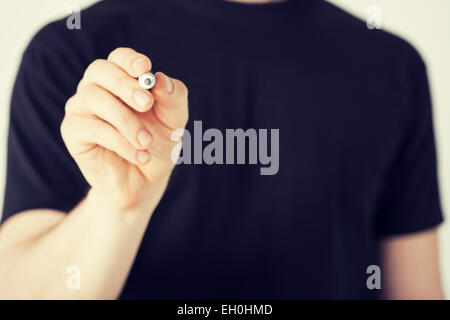 man writing something in the air Stock Photo