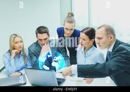 business team with laptop having discussion Stock Photo