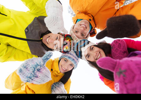 happy friends in winter clothes outdoors Stock Photo