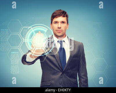attractive buisnessman working with virtual screen Stock Photo